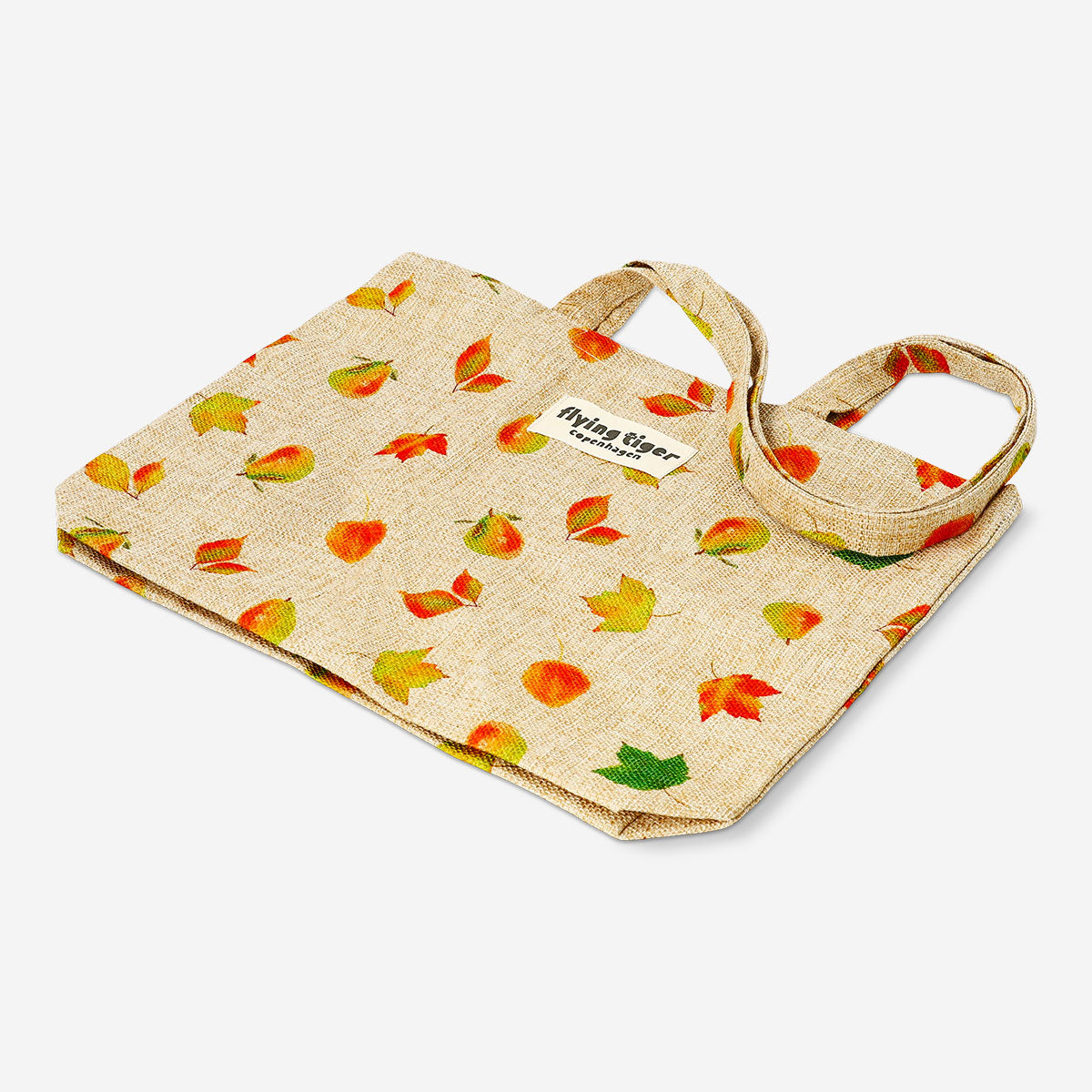 Textile tote bag with autumn leaves print by Flying Tiger Copenhagen, featuring a spacious design and natural leaf patterns.