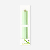 Green foldable office ruler with stencils from Flying Tiger Copenhagen, showing a compact design and stencil patterns.