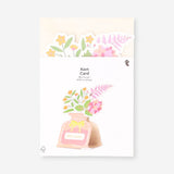 Office greeting card from Flying Tiger Copenhagen featuring a floral design and a vase with colorful flowers.