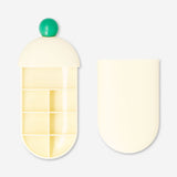 Flying Tiger Copenhagen leisure pill organiser with slide mechanism, compact and portable for daily medication management.
