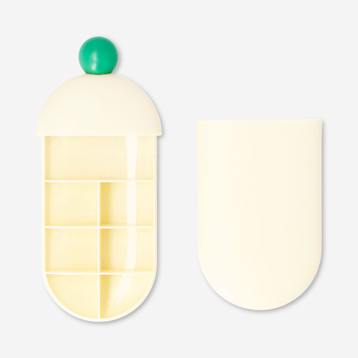 Flying Tiger Copenhagen leisure pill organiser with slide mechanism, compact and portable for daily medication management.