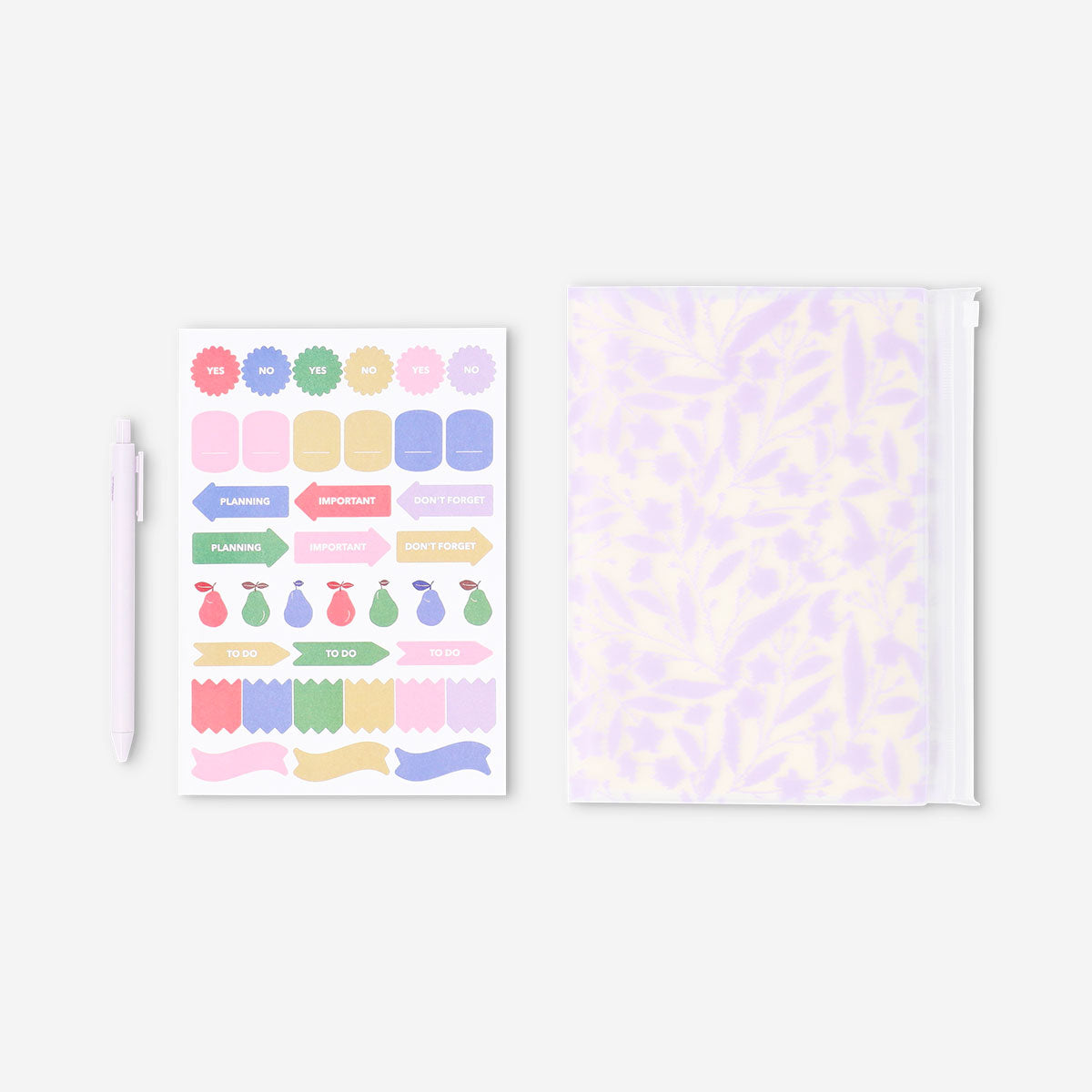 Flying Tiger Copenhagen floral office notebook with matching ballpoint pen and decorative stickers on a white background.