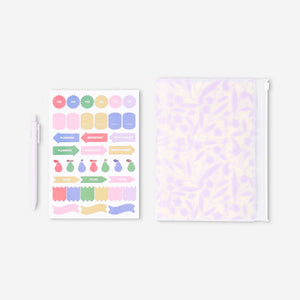 Flying Tiger Copenhagen floral office notebook with matching ballpoint pen and decorative stickers on a white background.