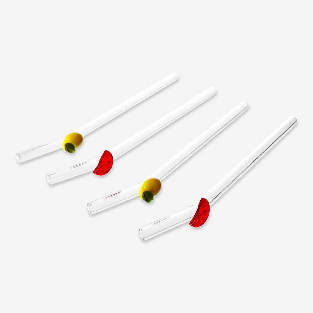 Set of four glass straws with colorful fruit decorations from Flying Tiger Copenhagen, ideal for enhancing drinks.