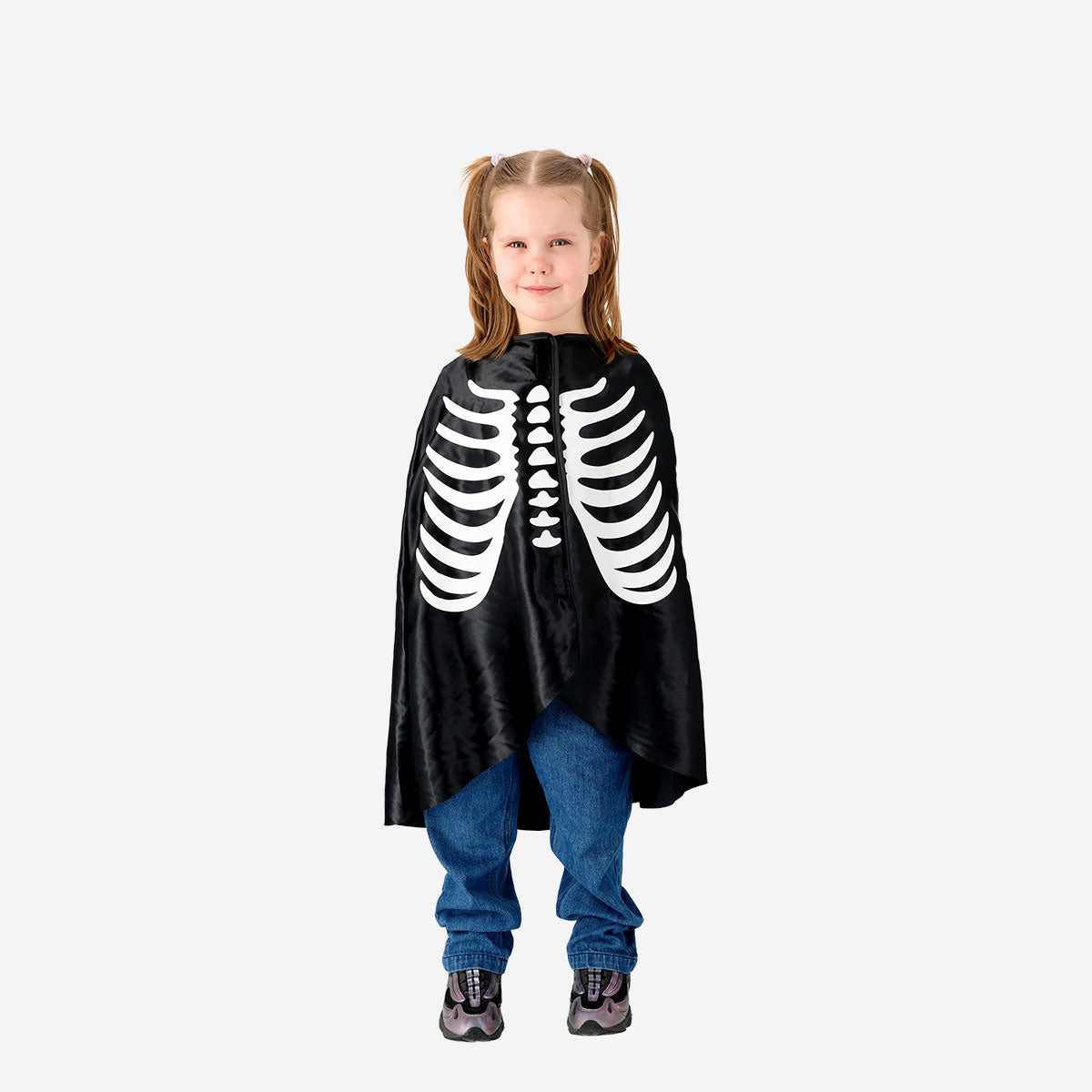 Kids Skeleton costume cape for parties by Flying Tiger Copenhagen, black with skeletal designs, perfect for Halloween or dress-up.
