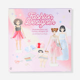 DIY fashion designer kit by Flying Tiger Copenhagen featuring colorful materials and tools for creative clothing design.
