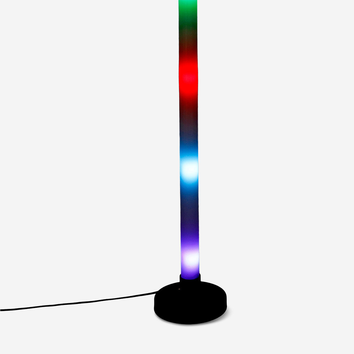 Color-changing LED tube gadget by Flying Tiger Copenhagen, glowing with vibrant multicolor light in a close-up shot.