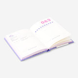 A6 Memory Journal in English by Flying Tiger Copenhagen, open with lined pages and colorful cover design for office or personal use.