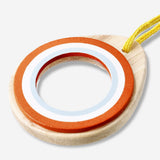 Wooden toy magnifying glass from Flying Tiger Copenhagen with a circular handle and clear glass lens.