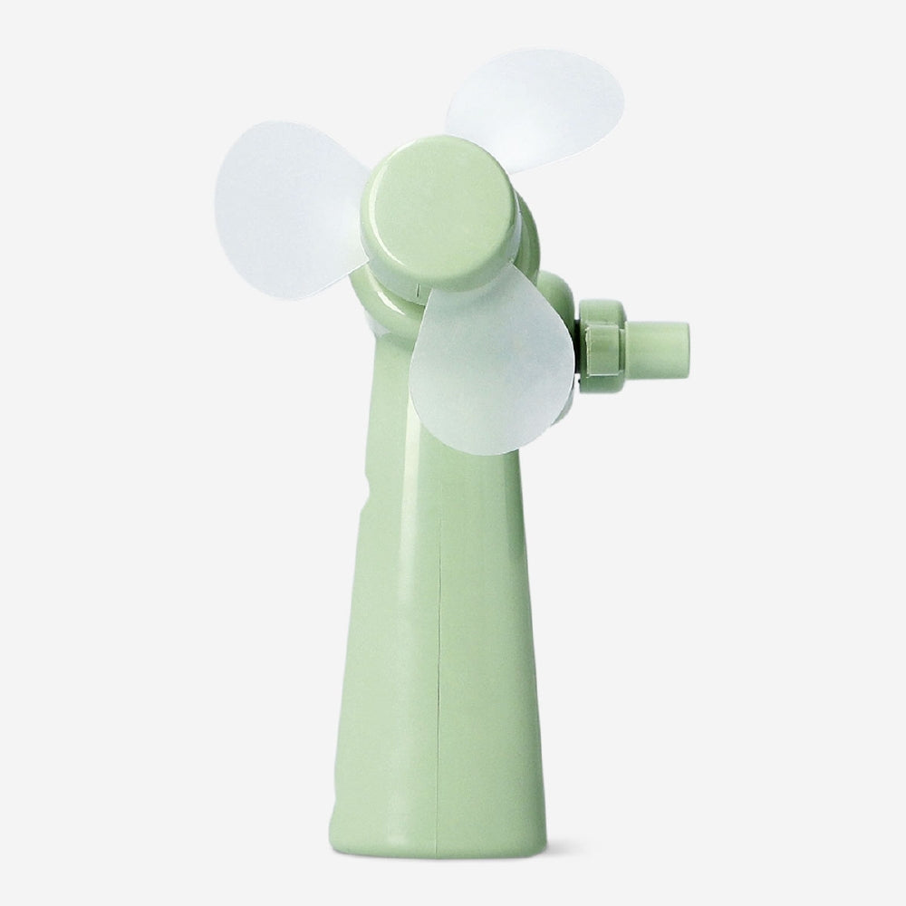 Green handheld fan gadget by Flying Tiger Copenhagen, compact and portable with a sleek design for personal cooling.