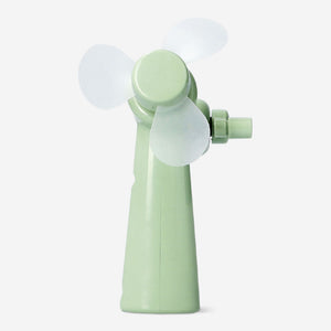 Green handheld fan gadget from Flying Tiger Copenhagen with a compact design and ergonomic handle.