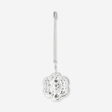 Flying Tiger Copenhagen flower tea infuser in kitchen, stainless steel mesh with flower-shaped design for brewing loose tea.