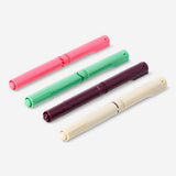 Set of four Flying Tiger Copenhagen dual-tip markers for journaling, featuring colorful ink and versatile tips for creative writing.