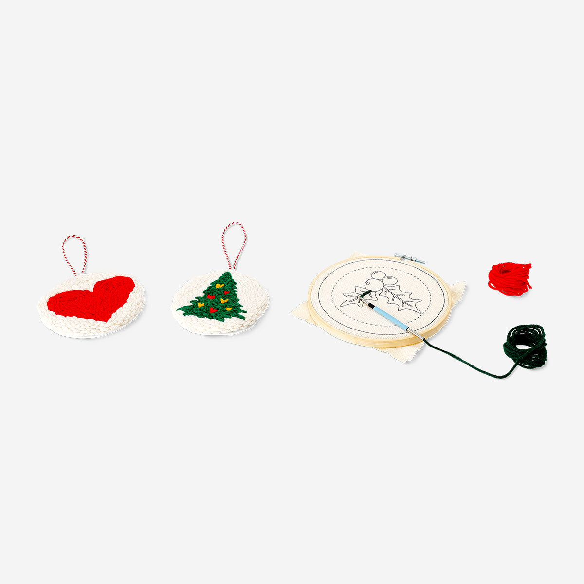 Christmas-themed punch needle set by Flying Tiger Copenhagen, featuring colorful yarn and tools for festive embroidery crafts.