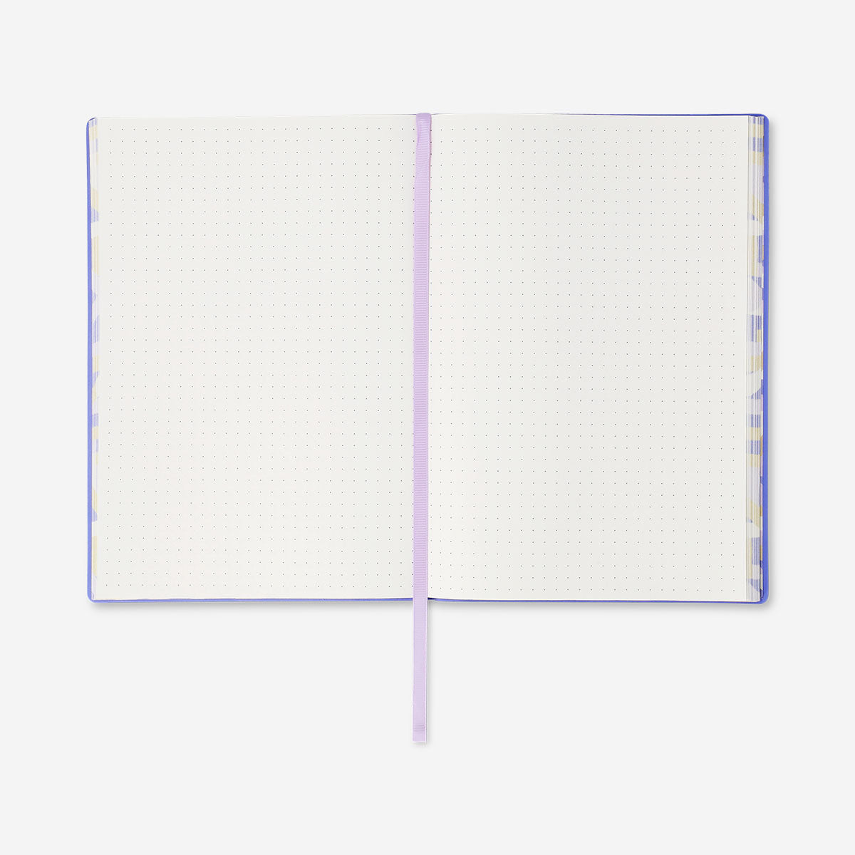 A5 lilac bullet planner with soft cover from Flying Tiger Copenhagen, open to show lined pages and compact office organizer design.