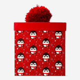 Office gift box with penguin and pom-pom decorations by Flying Tiger Copenhagen, featuring festive, playful design elements.