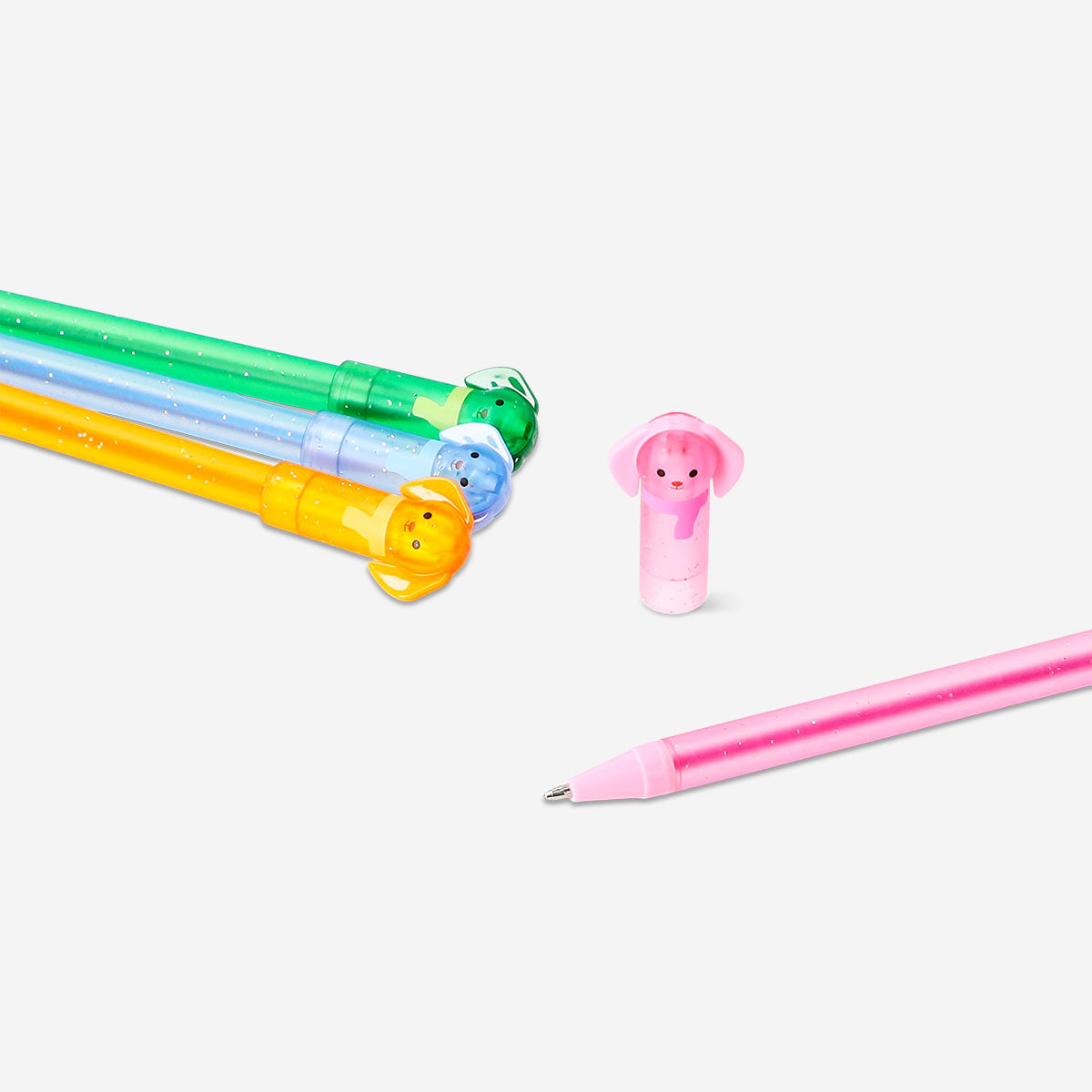 Set of four glitter gel pens with playful dog toppers from Flying Tiger Copenhagen, ideal for office or creative use.
