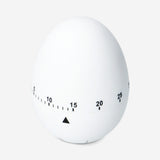 White kitchen egg timer from Flying Tiger Copenhagen with a round, minimalist design and clear time markings.