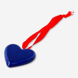 Blue ceramic heart hanging ornament for home decor, featuring a smooth finish and a hanging string from Flying Tiger Copenhagen.
