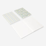 Set of three Flying Tiger Copenhagen A5 floral notebooks for office use, featuring colorful floral cover designs.
