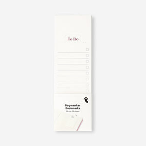 Flying Tiger Copenhagen paper bookmarks used as colorful office to-do list paper with a playful design.