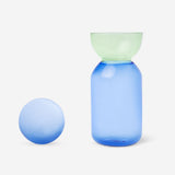 Blue and green ceramic jug with glass stopper, 1 liter capacity, perfect for kitchen use by Flying Tiger Copenhagen.