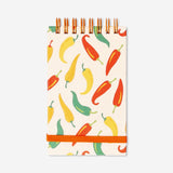 Flying Tiger Copenhagen office notepad featuring colorful chili pepper illustrations on the cover.