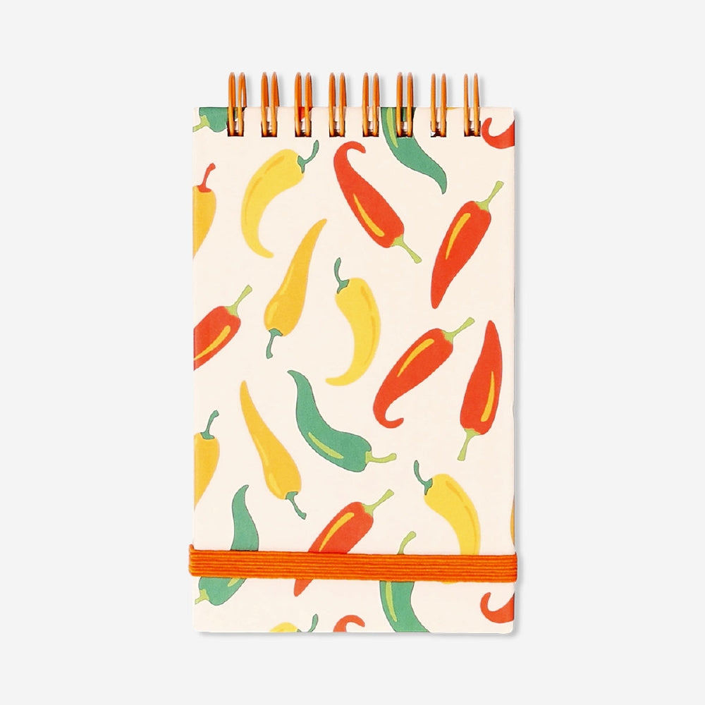 Flying Tiger Copenhagen office notepad featuring colorful chili pepper illustrations on the cover.