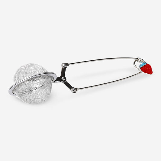 Metal tea strainer with strawberry charm