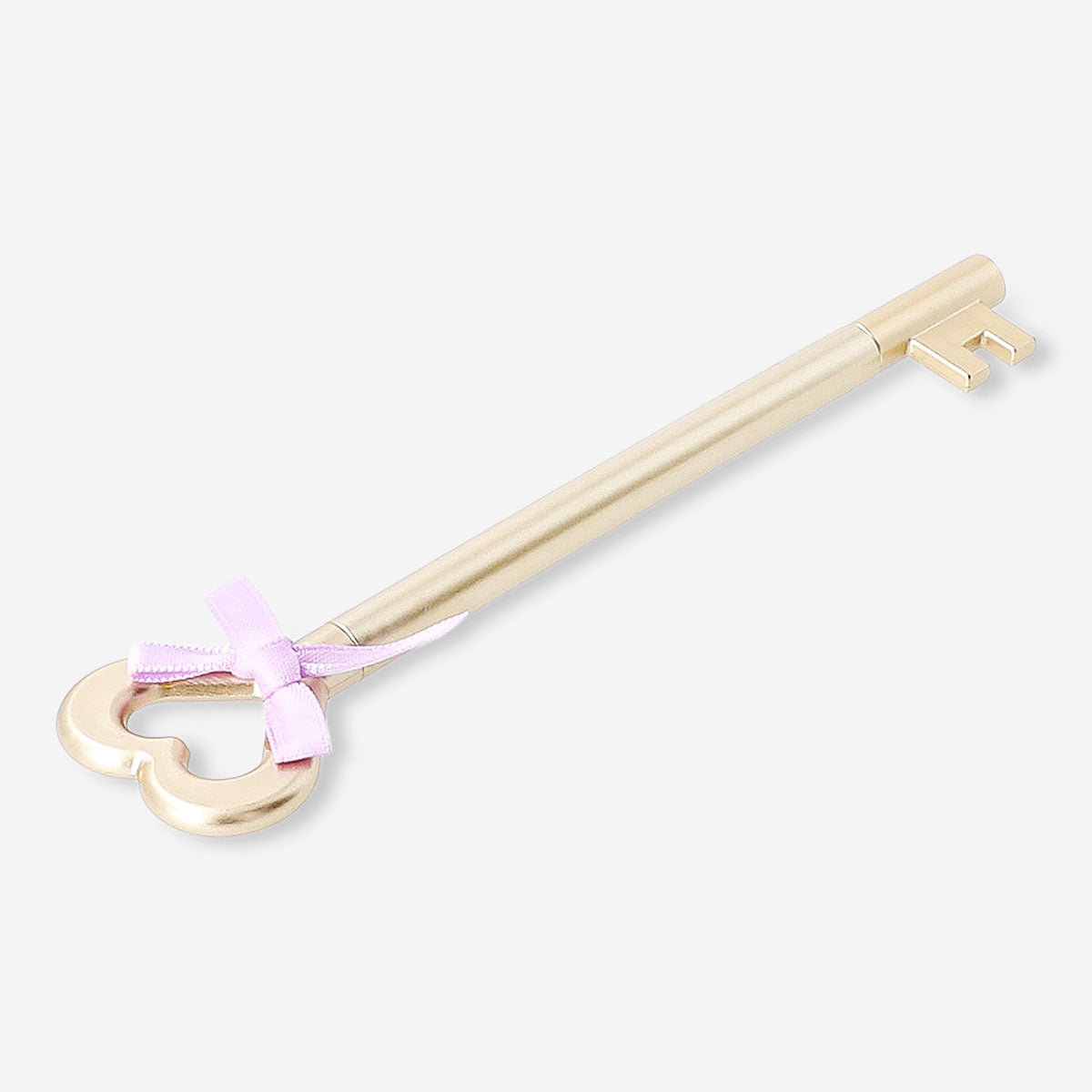 Gold ballpoint pen with key and bow design, ideal for office use, from Flying Tiger Copenhagen.