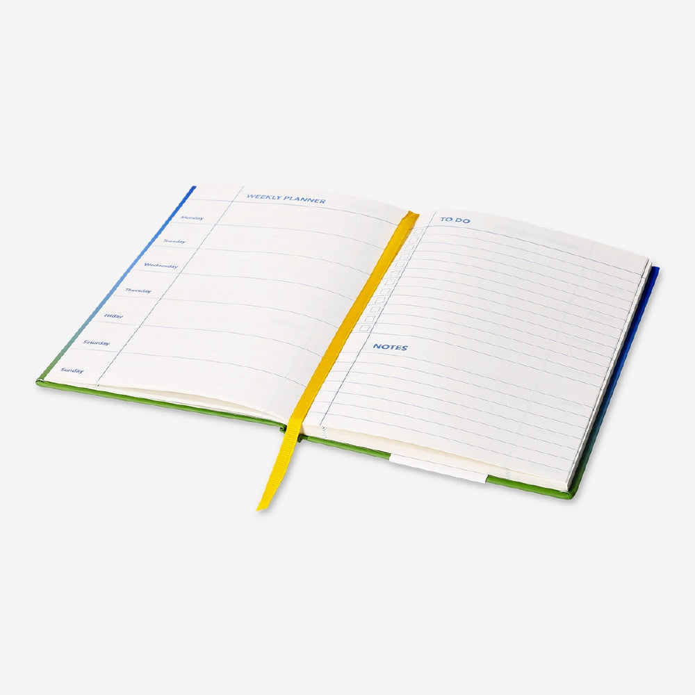 Blue A5 weekly planner by Flying Tiger Copenhagen, featuring a compact office organizer with weekly layout pages.