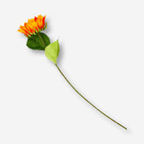 Decorative sunflower flower for home decor by Flying Tiger Copenhagen, featuring vibrant yellow petals and green leaves.
