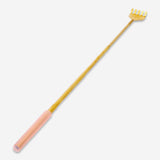 Gold telescopic back scratcher gadget from Flying Tiger Copenhagen with extendable handle for easy reaching.