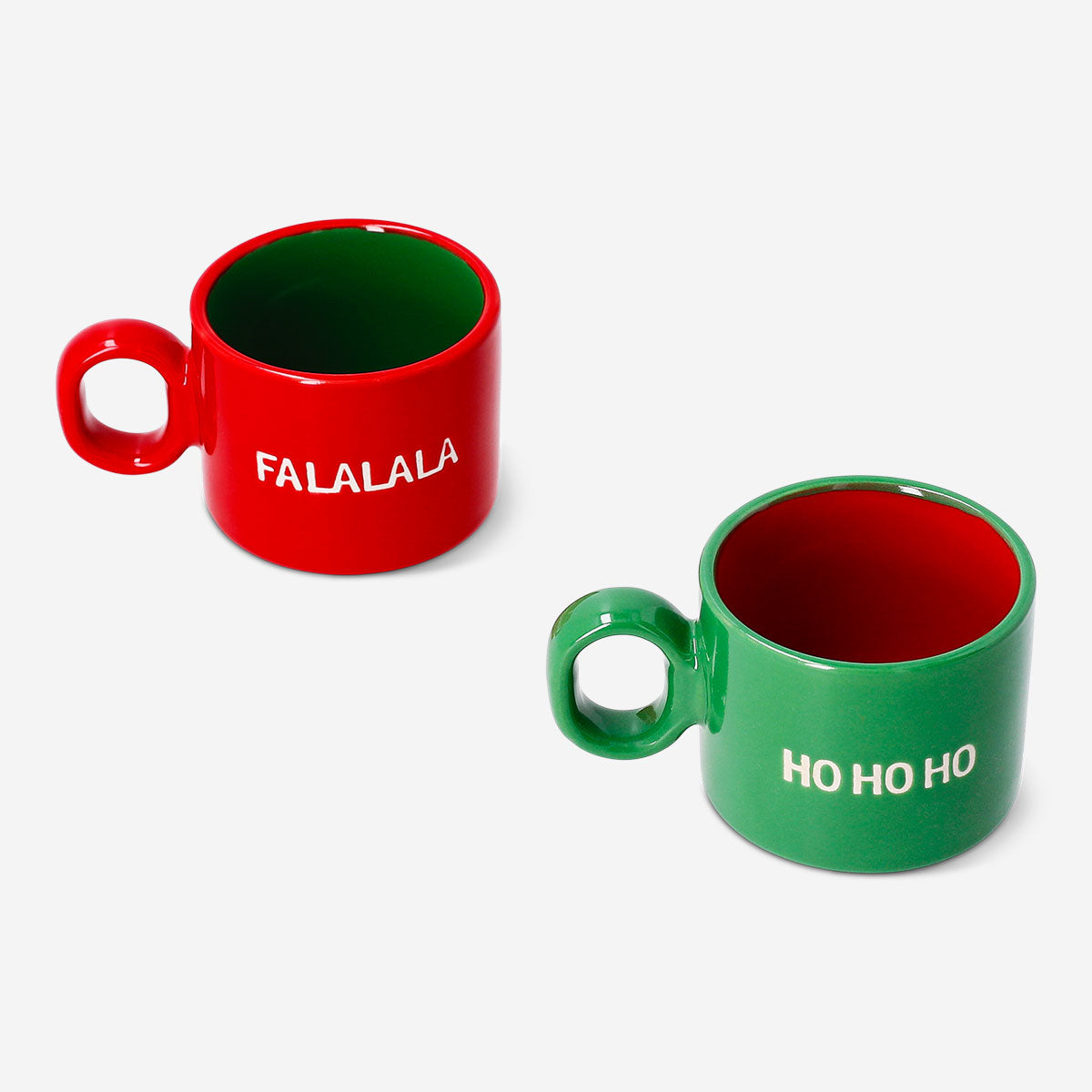 Two Flying Tiger Copenhagen cortado mugs with Christmas-themed text, featuring festive holiday designs on kitchen drinkware.