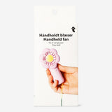Flying Tiger Copenhagen handheld fan with strap featuring a colorful floral design, compact gadget for cooling on the go.