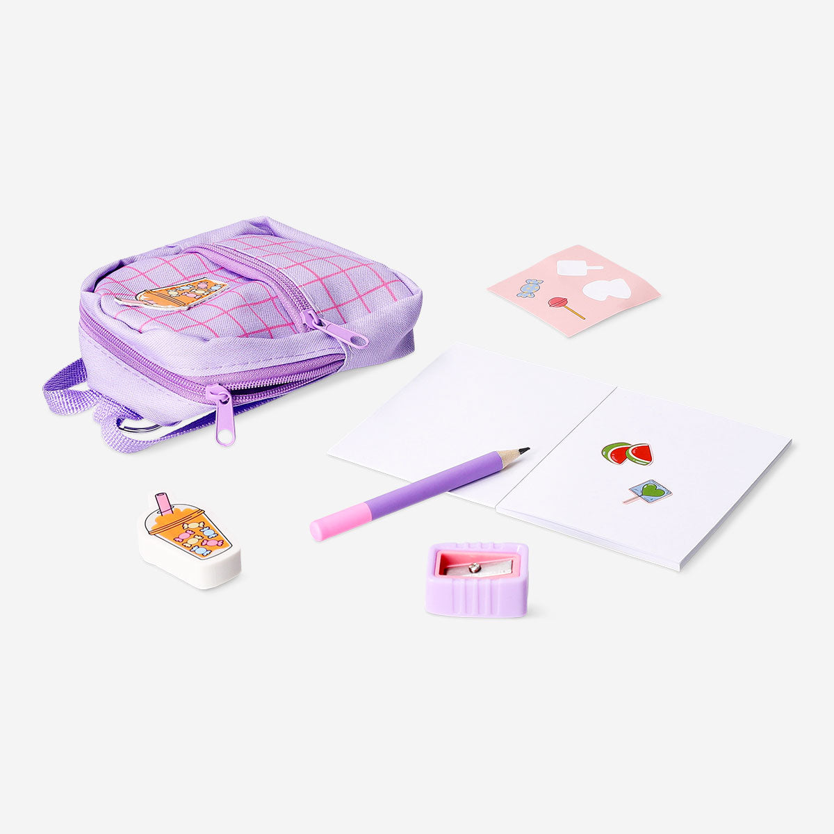 Candy-themed mini backpack stationery kit by Flying Tiger Copenhagen, featuring colorful office supplies in a playful design.