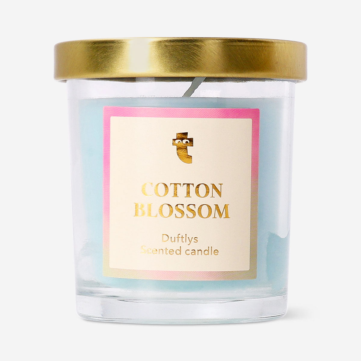 Flying Tiger Copenhagen scented candle with cotton blossom fragrance, featuring a white candle in a simple glass holder for home ambiance.