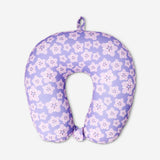 Purple floral travel pillow by Flying Tiger Copenhagen, showing soft fabric with a vibrant floral pattern for comfortable travel.