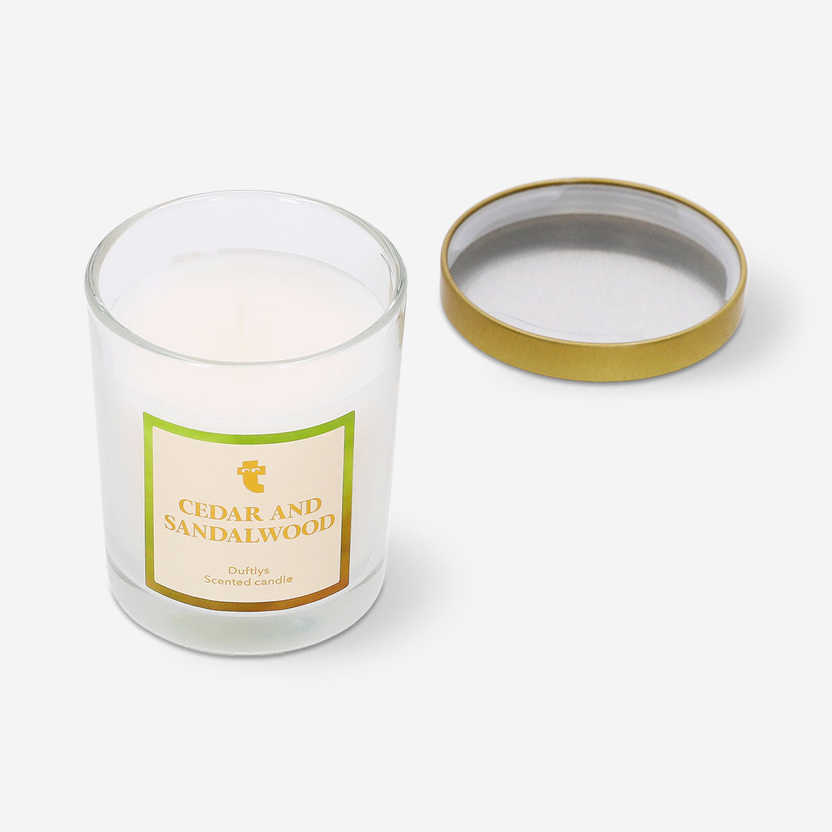 Flying Tiger Copenhagen scented candle with cedar and sandalwood fragrance, featuring a simple glass holder and warm, inviting glow.