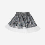 Cute silver metallic effect party skirt for girls aged 4 to 8 years by Flying Tiger Copenhagen, showcasing shiny fabric and playful style.