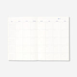 A4 floral monthly planner in English with colorful floral cover, designed for office organization by Flying Tiger Copenhagen.