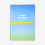 Blue A5 weekly office planner by Flying Tiger Copenhagen with open pages showing weekly layout and date sections.