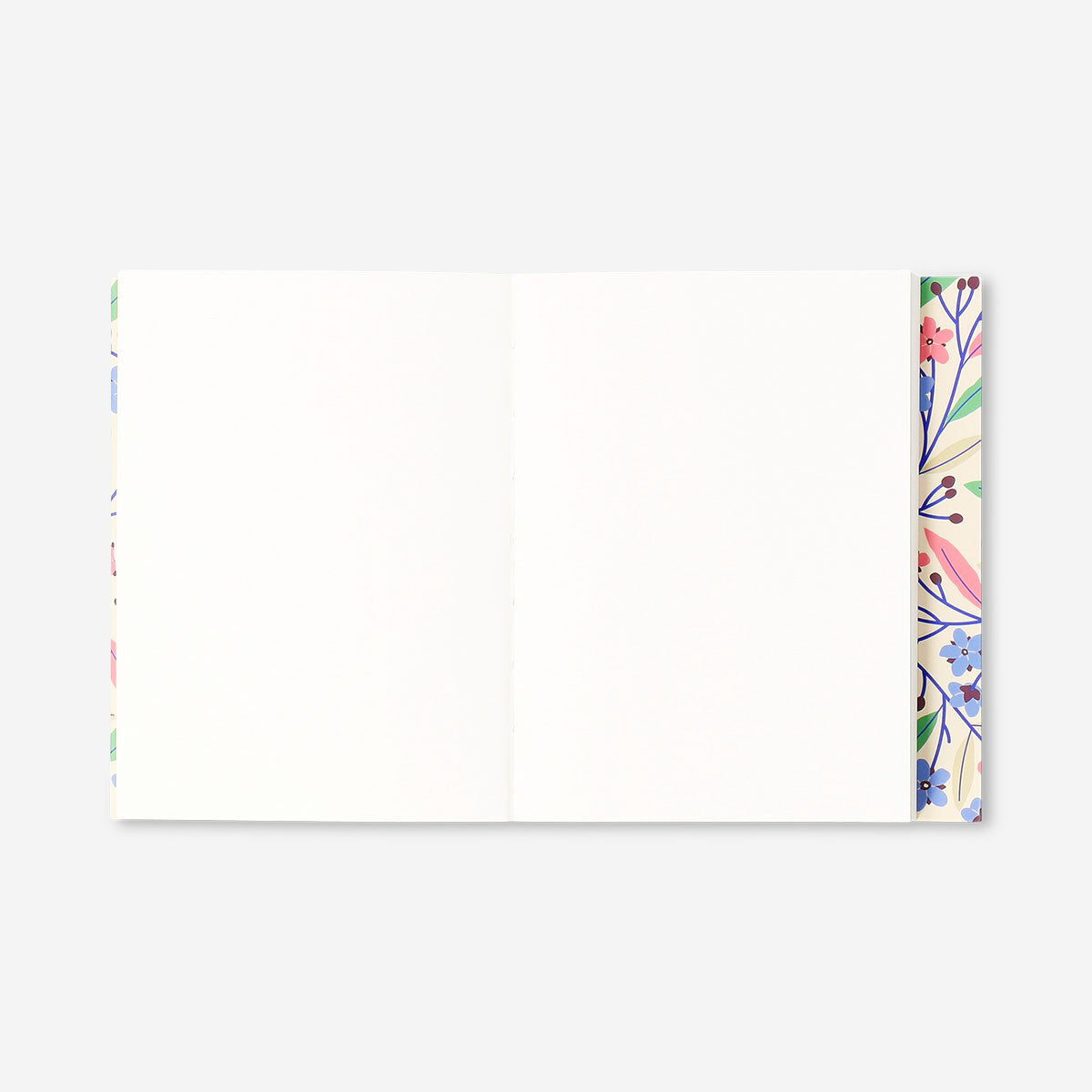 Floral office notebook by Flying Tiger Copenhagen with colorful flower cover, ideal for writing and note-taking.