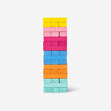 Wooden stacking towers game by Flying Tiger Copenhagen, colorful cylindrical blocks stacked in a playful arrangement.