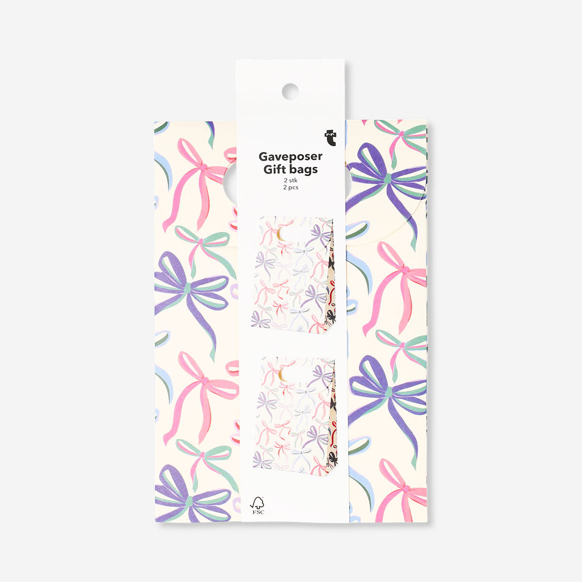 Two office gift bags with bows from Flying Tiger Copenhagen, featuring decorative paper and ribbon accents for wrapping presents.