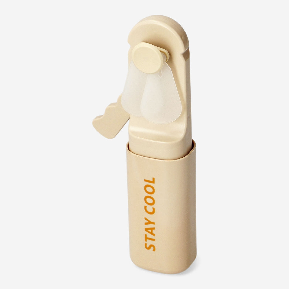Orange handheld fan gadget by Flying Tiger Copenhagen, compact and portable, designed to keep you cool on the go.