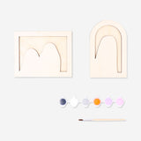 DIY wooden ghost craft from Flying Tiger Copenhagen, painted with colorful details for a fun hobby project.
