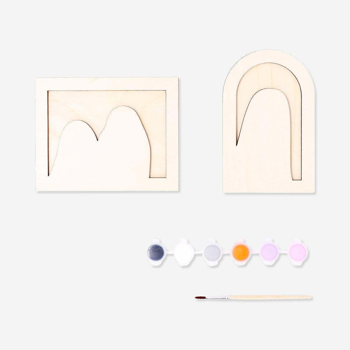 DIY wooden ghost craft from Flying Tiger Copenhagen, painted with colorful details for a fun hobby project.