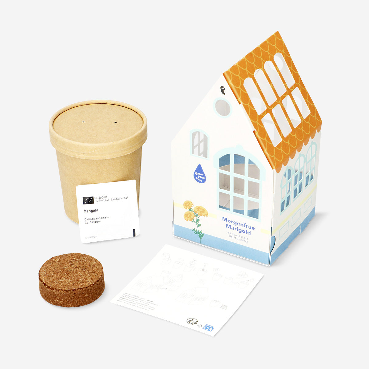 Home grow kit for marigolds by Flying Tiger Copenhagen, featuring marigold seeds, soil, and planting tools in a compact kit.