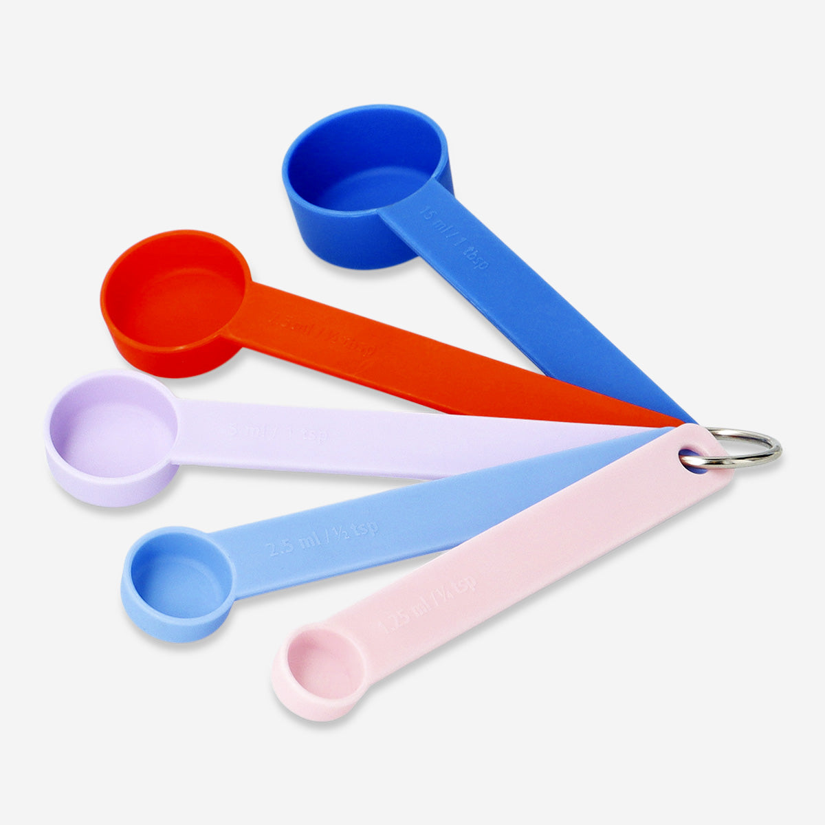 Set of four Flying Tiger Copenhagen designer kitchen measuring spoons arranged in a row on a white background.